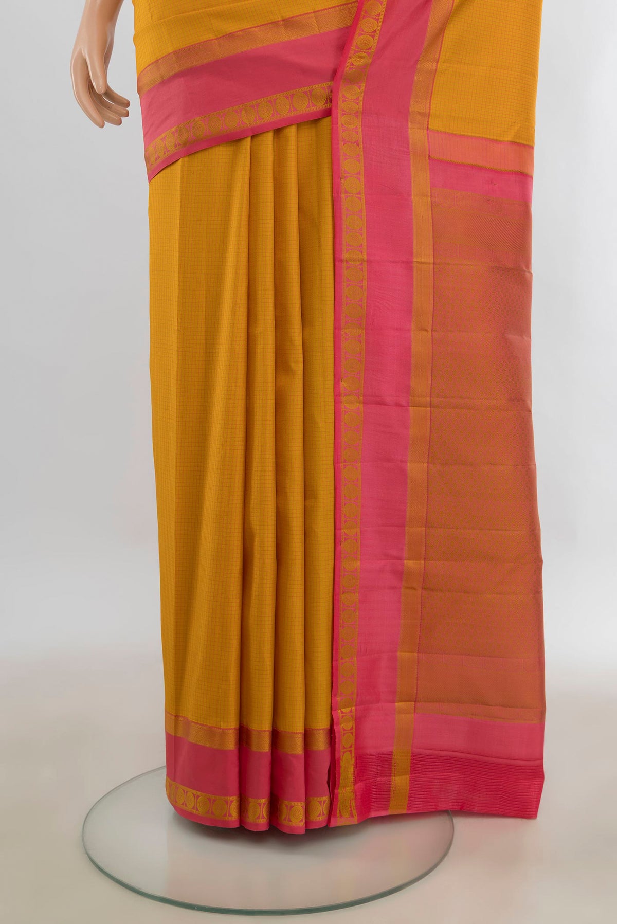 Pleats and pallu of Pure Silk Mustard Kanjivaram Saree with Checked design on the body and Thread Border. 