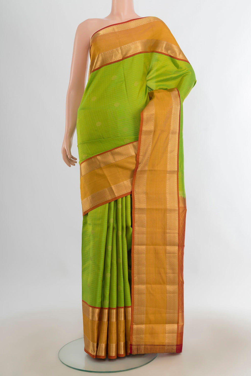 Pure Silk Parrot Green Kanchipuram Saree with Zari Butta on the body and Silk Border.  displayed on a mannequin