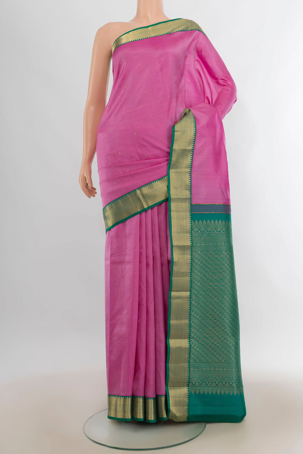 Pure Silk Rose pink Kanjivaram Saree with Zari Butta on the body and Zari Border.  displayed on a mannequin