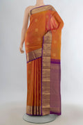 Pure Silk Mustard Kanjivaram Saree with Zari Butta on the body and Zari Border.  displayed on a mannequin