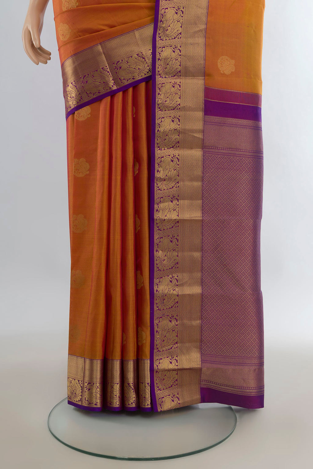 Pleats and pallu of Pure Silk Mustard Kanjivaram Saree with Zari Butta on the body and Zari Border. 