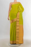 Pure Silk Parrot Green Kanchipuram Saree with Zari Butta on the body and Zari Border.  displayed on a mannequin