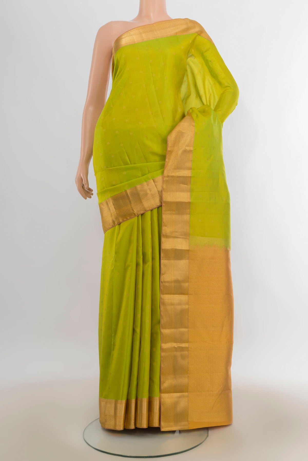 Pure Silk Parrot Green Kanchipuram Saree with Zari Butta on the body and Zari Border.  displayed on a mannequin