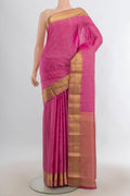 Pure Silk Rose pink Kanchipuram Saree with Zari Butta on the body and Zari Border.  displayed on a mannequin