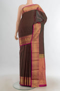 Pure Silk Coffee Brown Kanjivaram Saree with Zari Butta on the body and Silk Border.  displayed on a mannequin