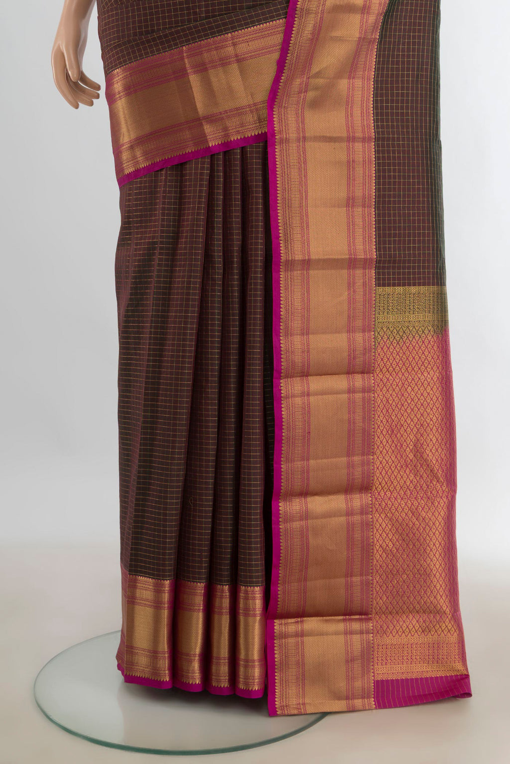 Pleats and pallu of Pure Silk Coffee Brown Kanjivaram Saree with Zari Butta on the body and Silk Border. 