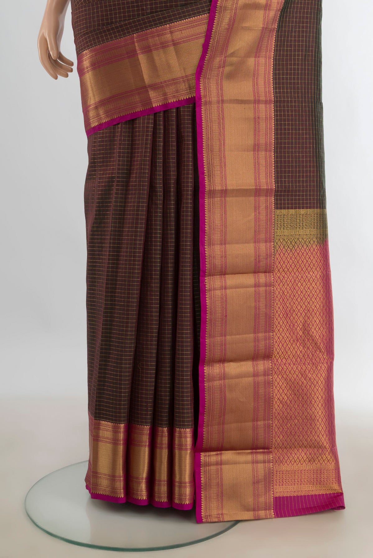 Pleats and pallu of Pure Silk Coffee Brown Kanjivaram Saree with Zari Butta on the body and Silk Border. 