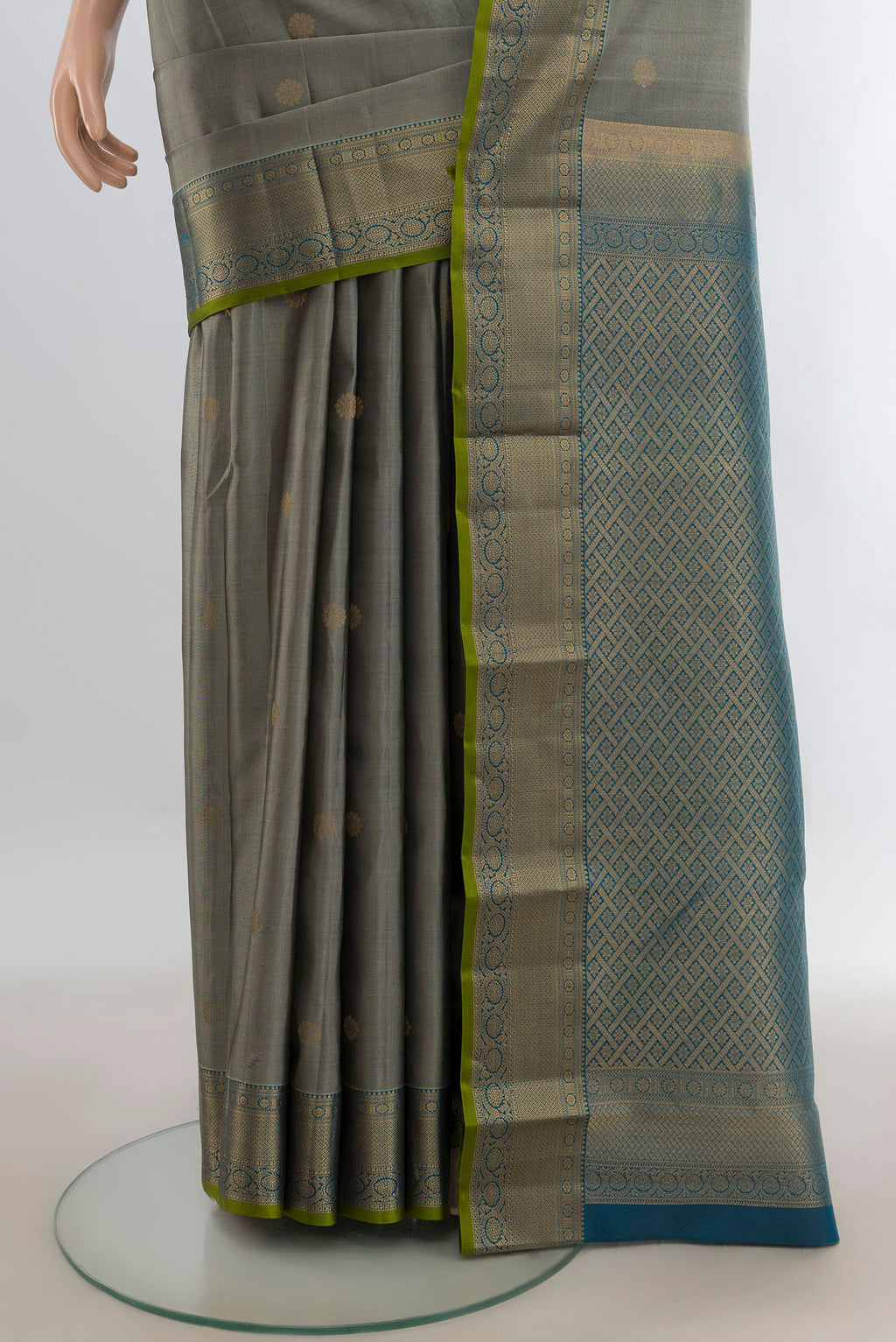 Pleats and pallu of Pure Silk Grey Kanjivaram Saree with Zari Butta on the body and Zari Border. 