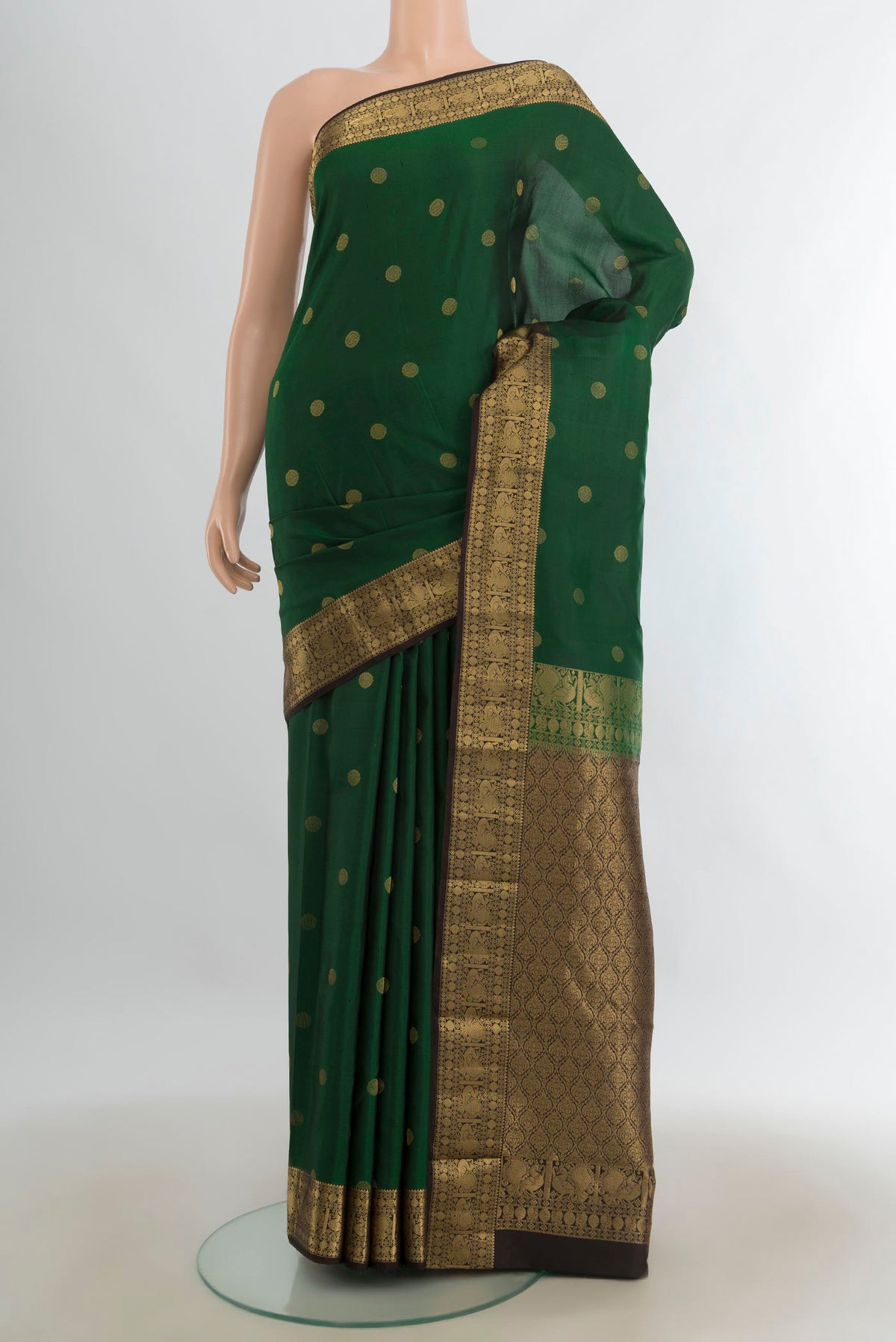 Pure Silk Mint Green Kanchipuram Saree with Zari Butta on the body and Silk Border.  displayed on a mannequin