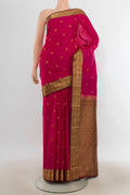 Pure Silk Dark Pink Kanchipuram Saree with Zari Butta on the body and Zari Border.  displayed on a mannequin