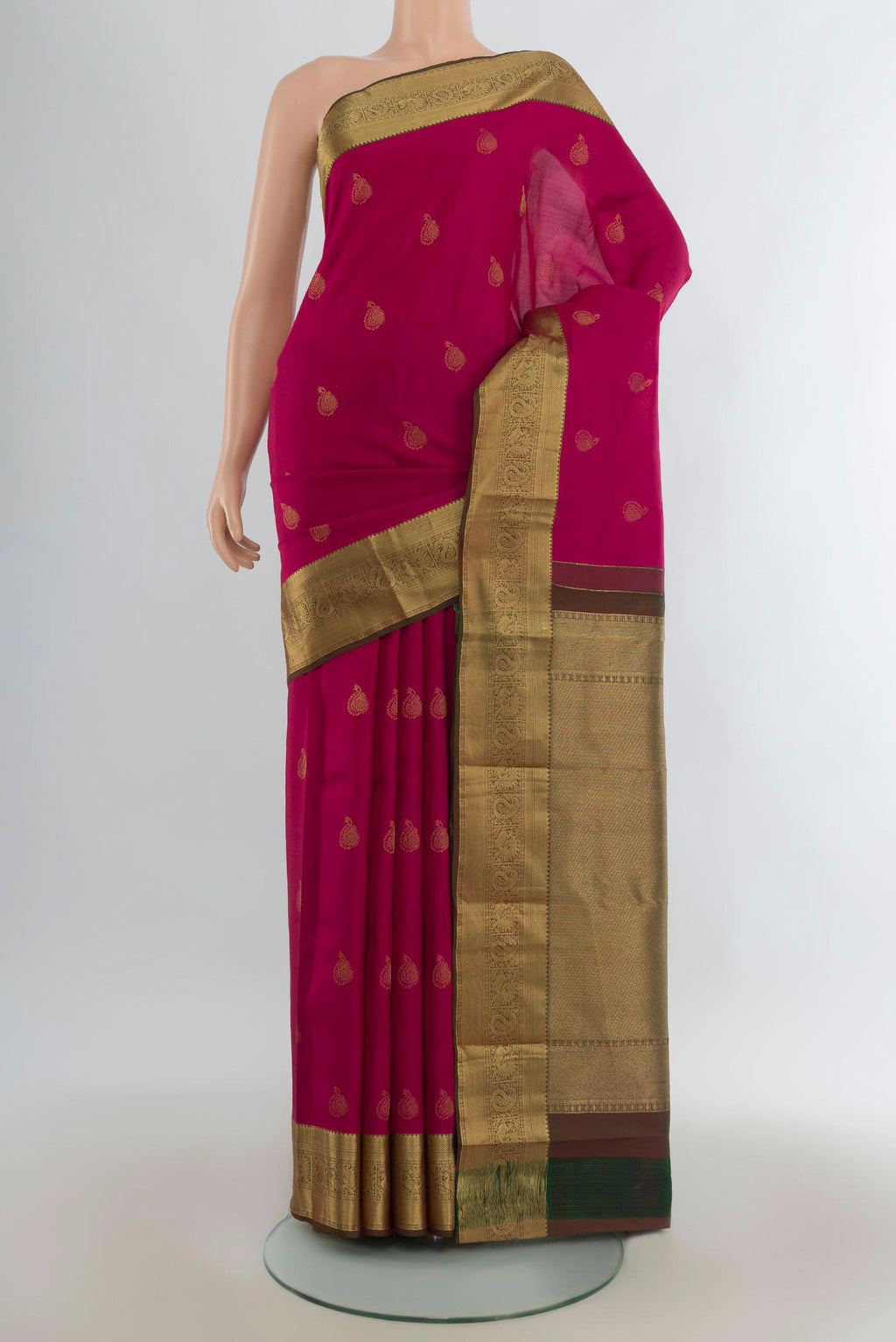 Pure Silk Dark Pink Kanjivaram Saree with Zari Butta on the body and Zari Border.  displayed on a mannequin