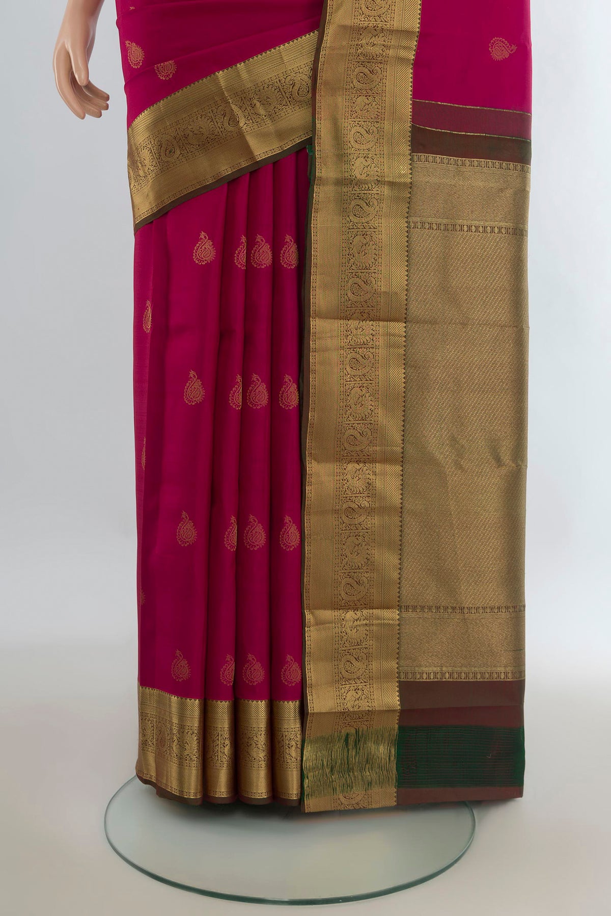 Pleats and pallu of Pure Silk Dark Pink Kanjivaram Saree with Zari Butta on the body and Zari Border. 