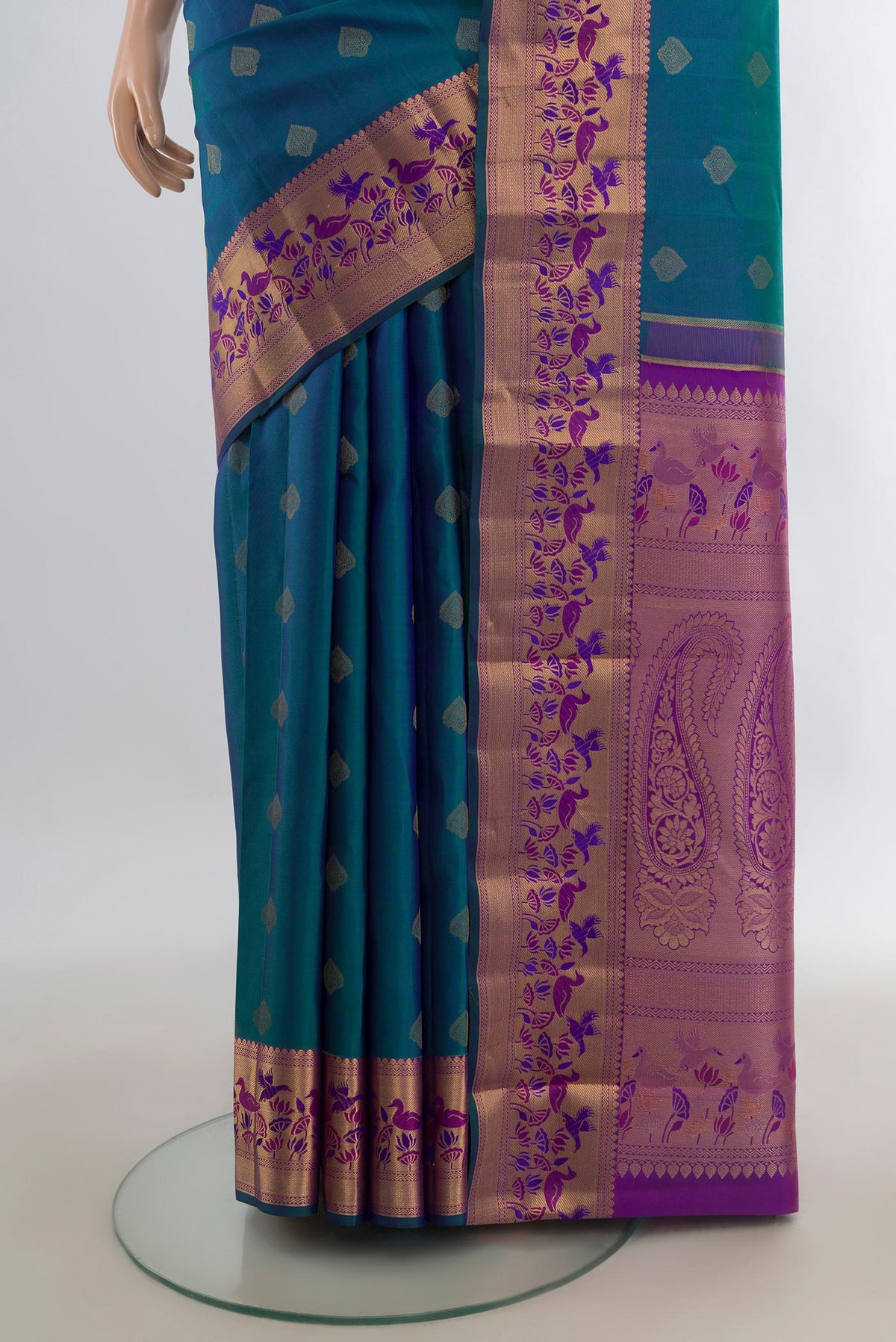Pleats and pallu of Pure Silk Peacock Blue Kanjivaram Saree with Zari Butta on the body and Zari Border. 