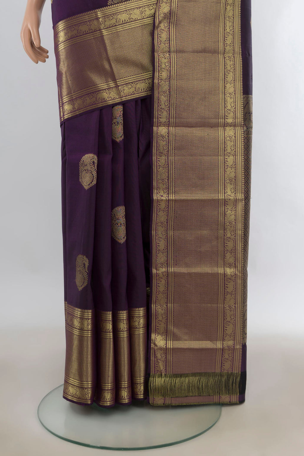 Pleats and pallu of Pure Silk Purple Kanjivaram Saree with Zari Butta on the body and Zari Border. 