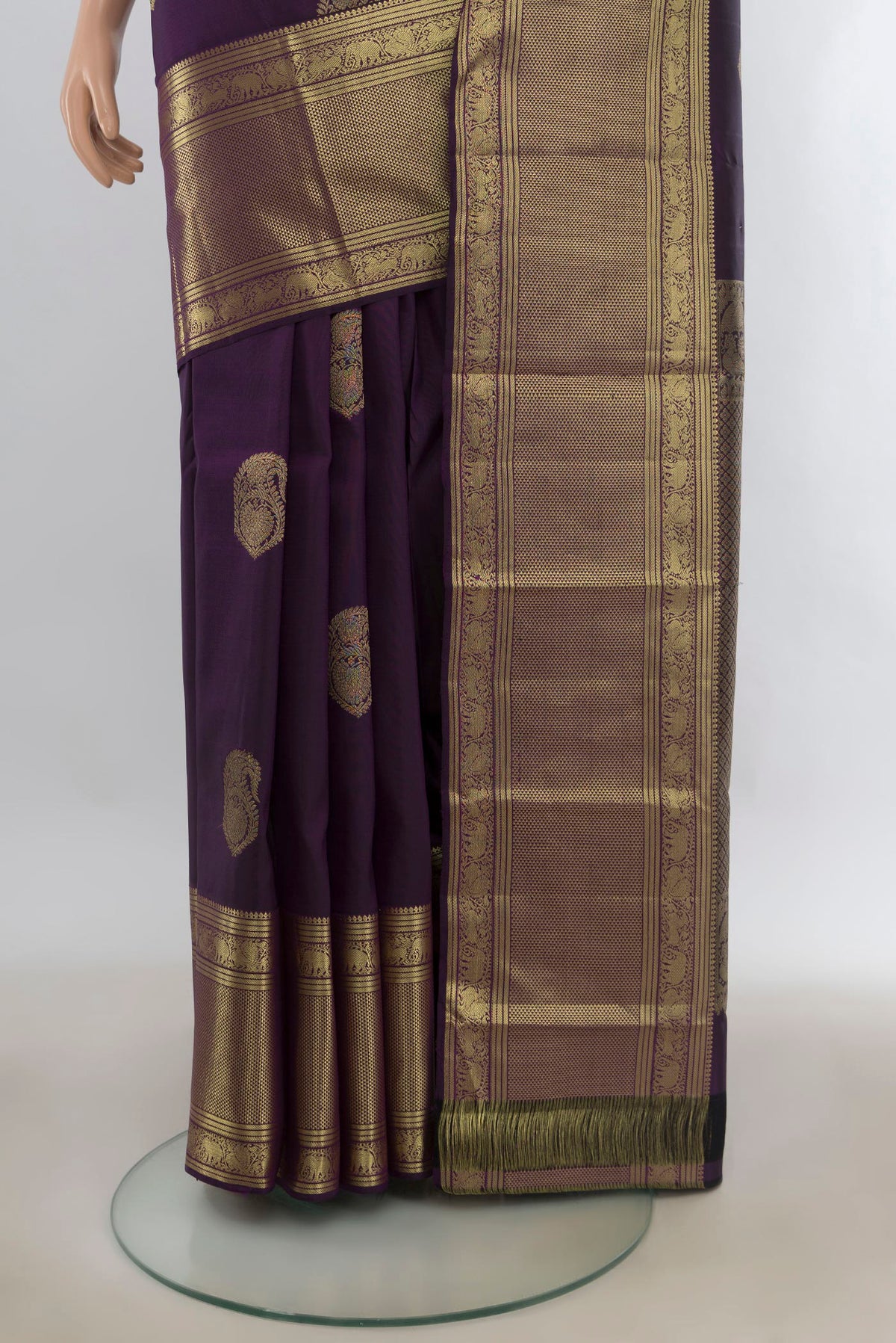Pleats and pallu of Pure Silk Purple Kanjivaram Saree with Zari Butta on the body and Zari Border. 