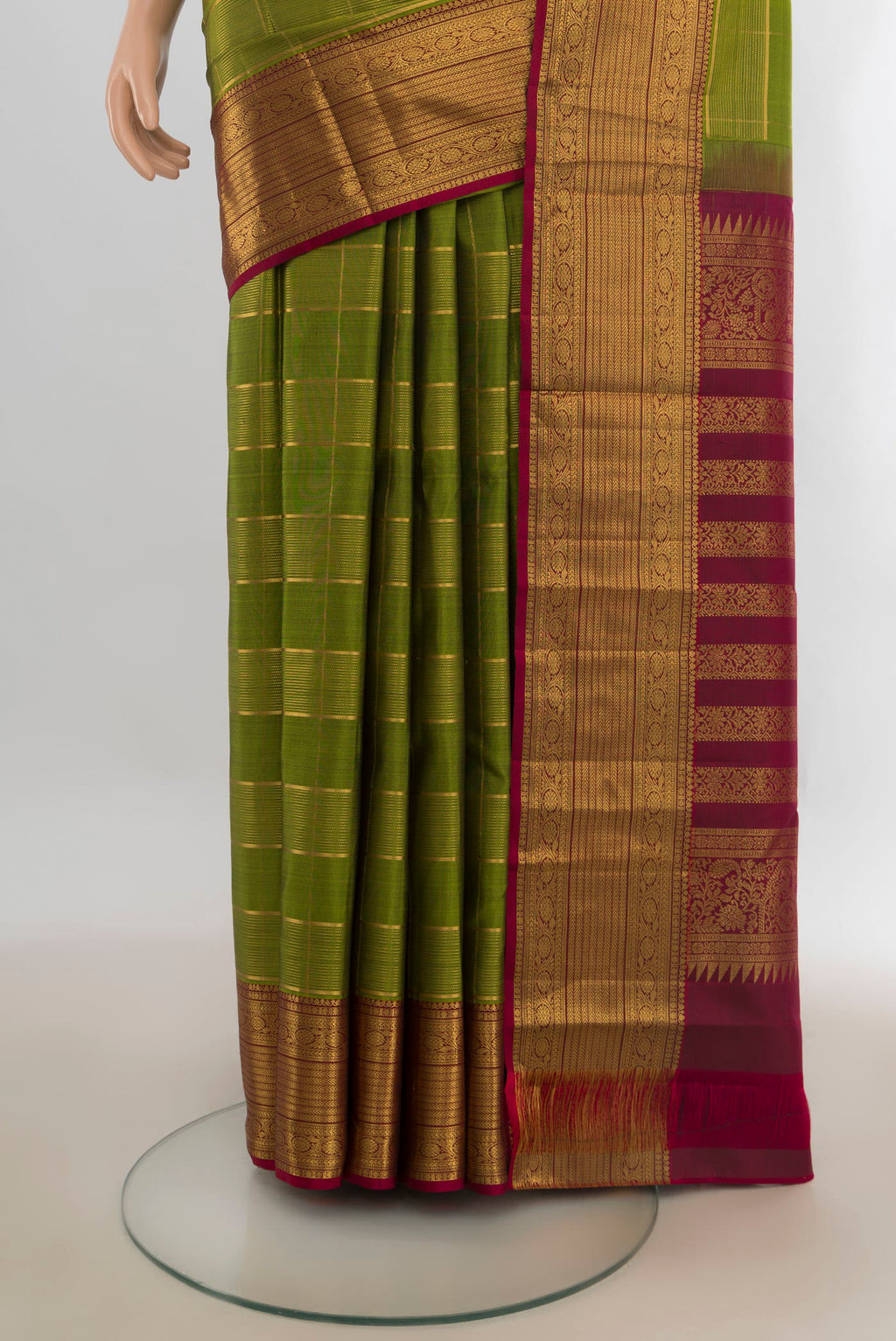 Pleats and pallu of Pure Silk Mehandi Green Kanjivaram Saree with Checked design on the body and Zari Border. 