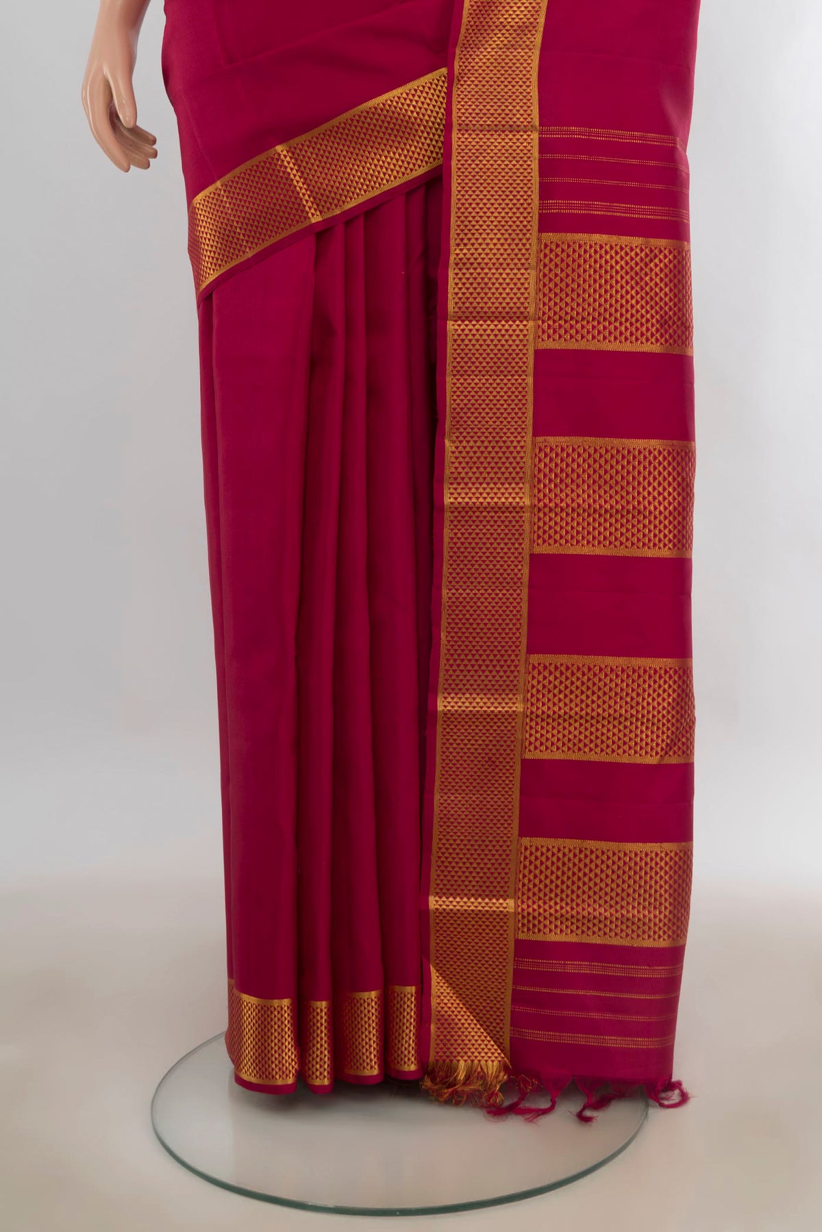 Pleats and pallu of Pure Silk Maroon Kanjivaram Saree with Plain Body and Zari Border. 