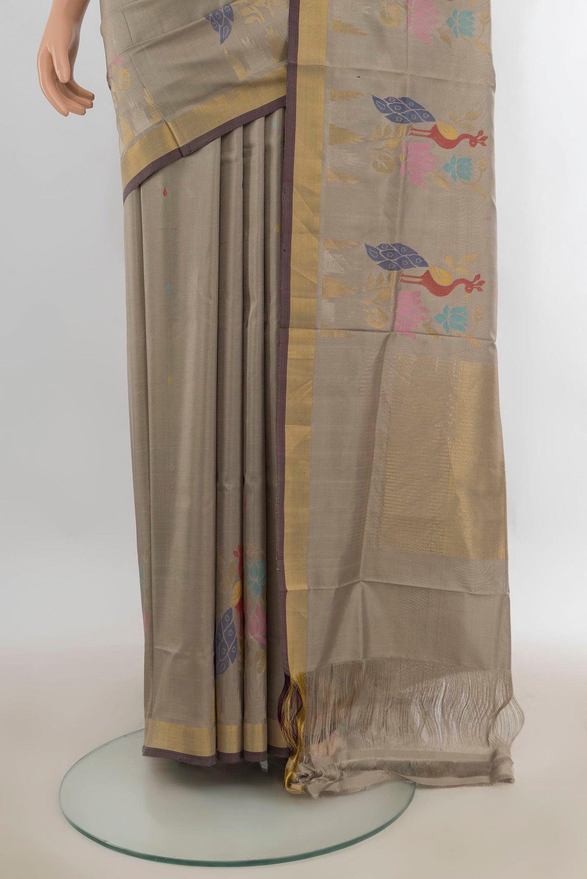Pleats and pallu of Pure Silk Grey Uppada Saree with Zari Butta on the body and Zari Border. 