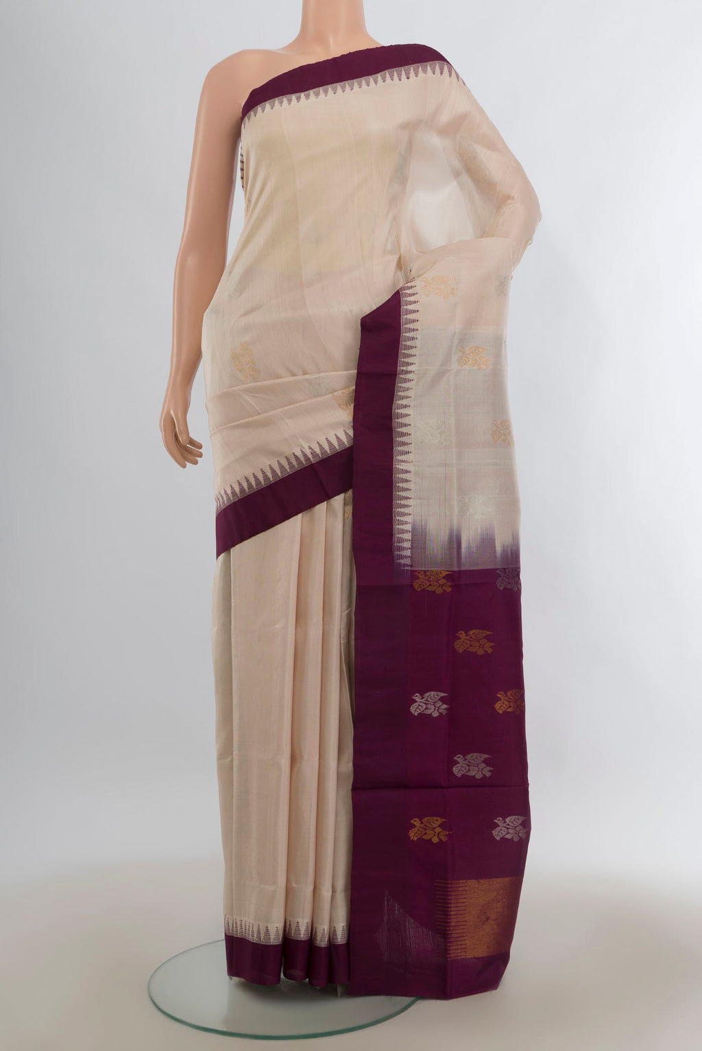 Pure Silk Cream Uppada Saree with Zari Butta on the body and Temple Border.  displayed on a mannequin