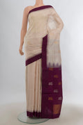 Pure Silk Cream Uppada Saree with Zari Butta on the body and Temple Border.  displayed on a mannequin