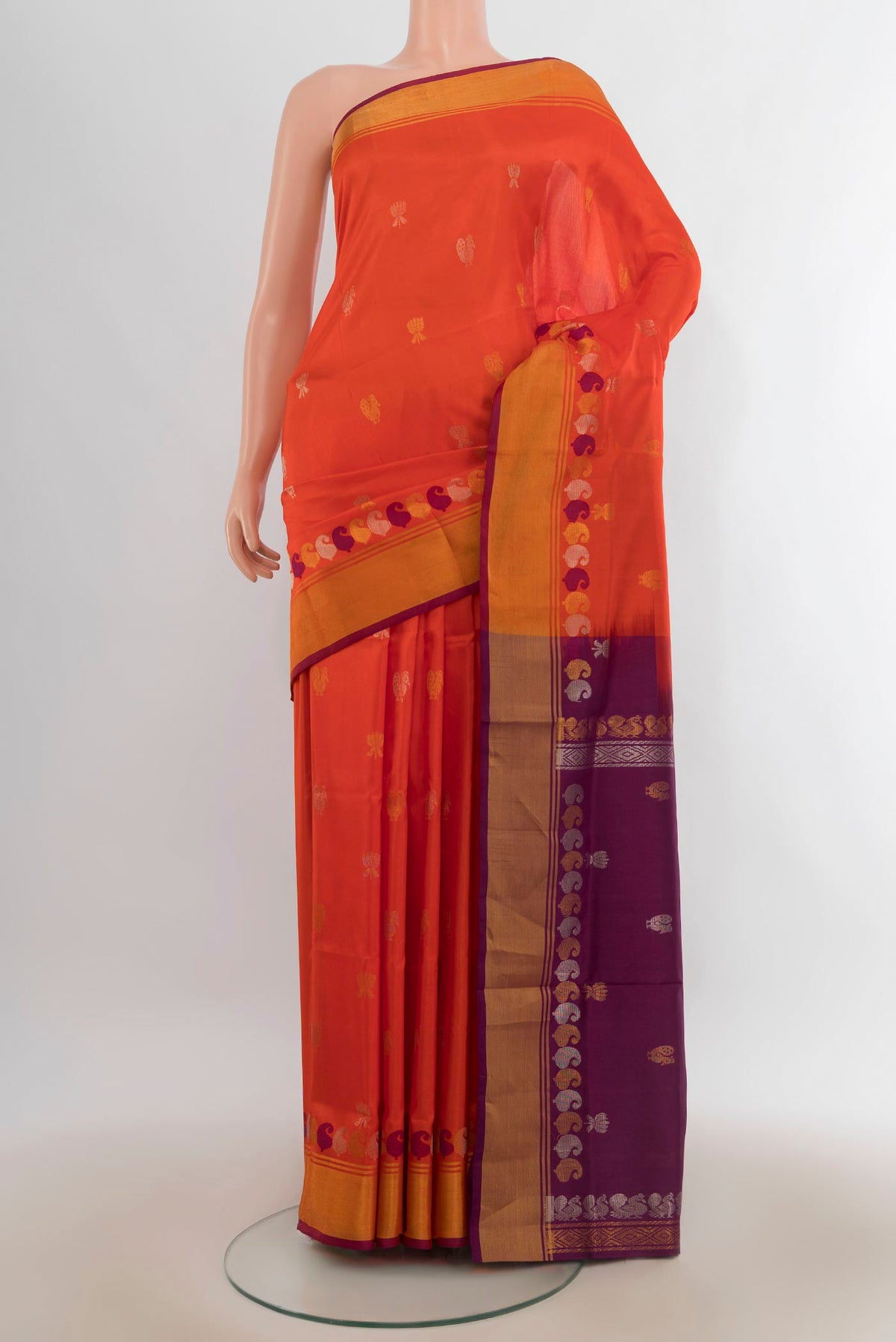Pure Silk Brick Orange Uppada Saree with Zari Butta on the body and Zari Border.  displayed on a mannequin