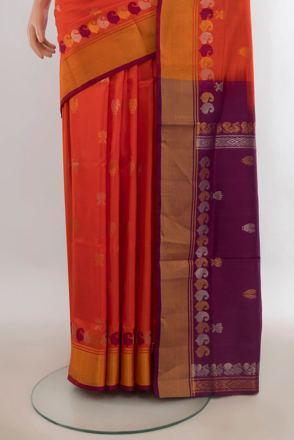 Pleats and pallu of Pure Silk Brick Orange Uppada Saree with Zari Butta on the body and Zari Border. 