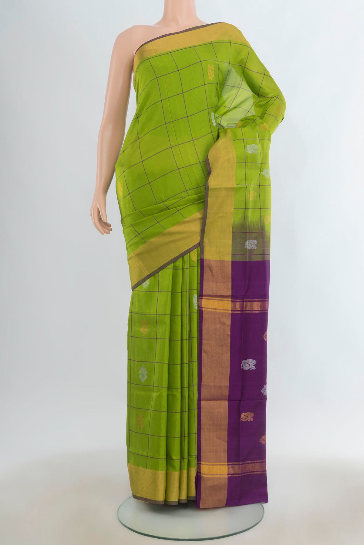 Pure Silk Parrot Green Uppada Saree with Checked design on the body and Zari Border.  displayed on a mannequin
