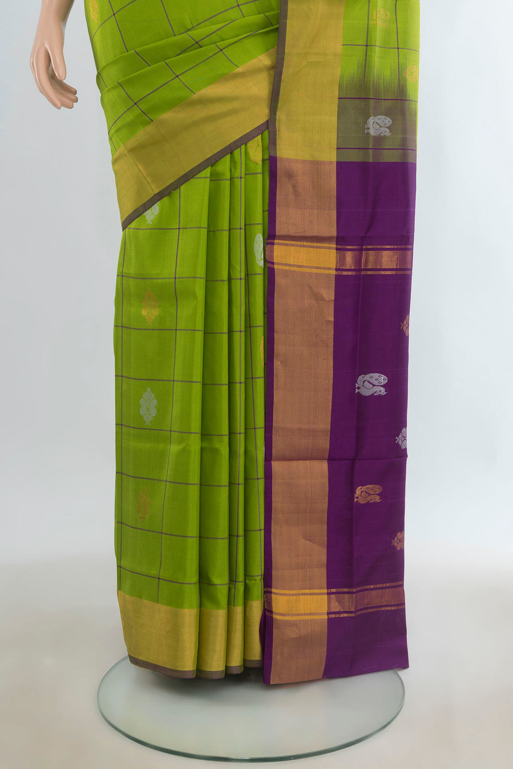 Pleats and pallu of Pure Silk Parrot Green Uppada Saree with Checked design on the body and Zari Border. 