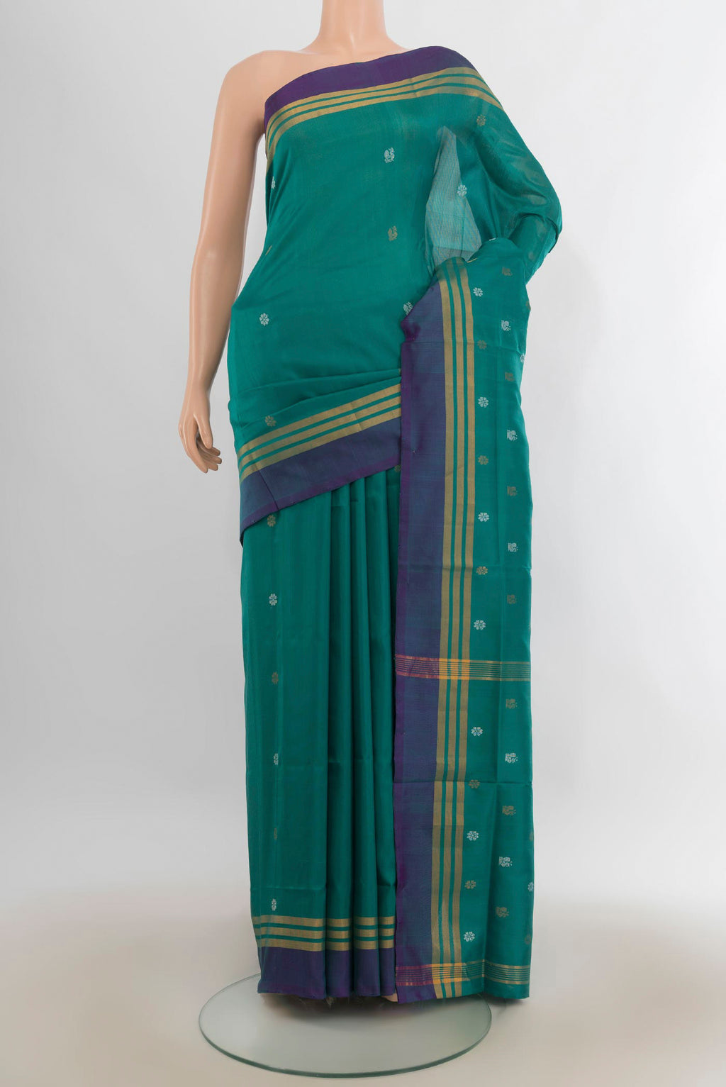 Pure Silk Teal Uppada Saree with Zari Butta on the body and Plain Border.  displayed on a mannequin
