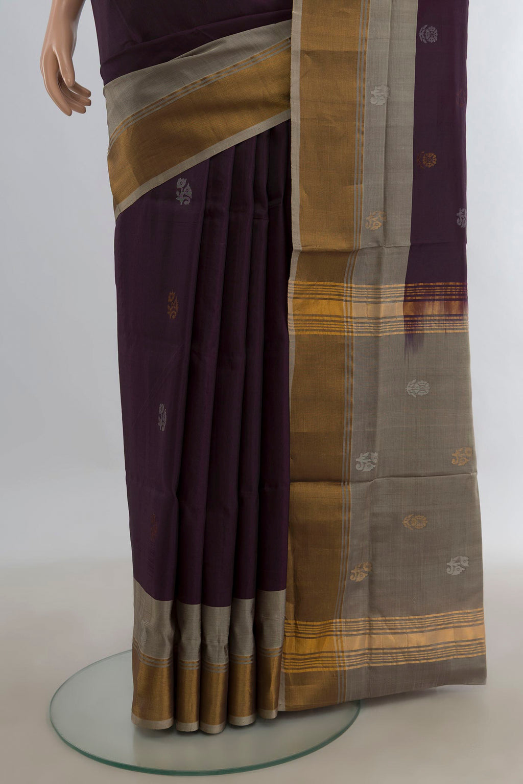 Pleats and pallu of Pure Silk Coffee Brown Uppada Saree with Zari Butta on the body and Zari Border. 