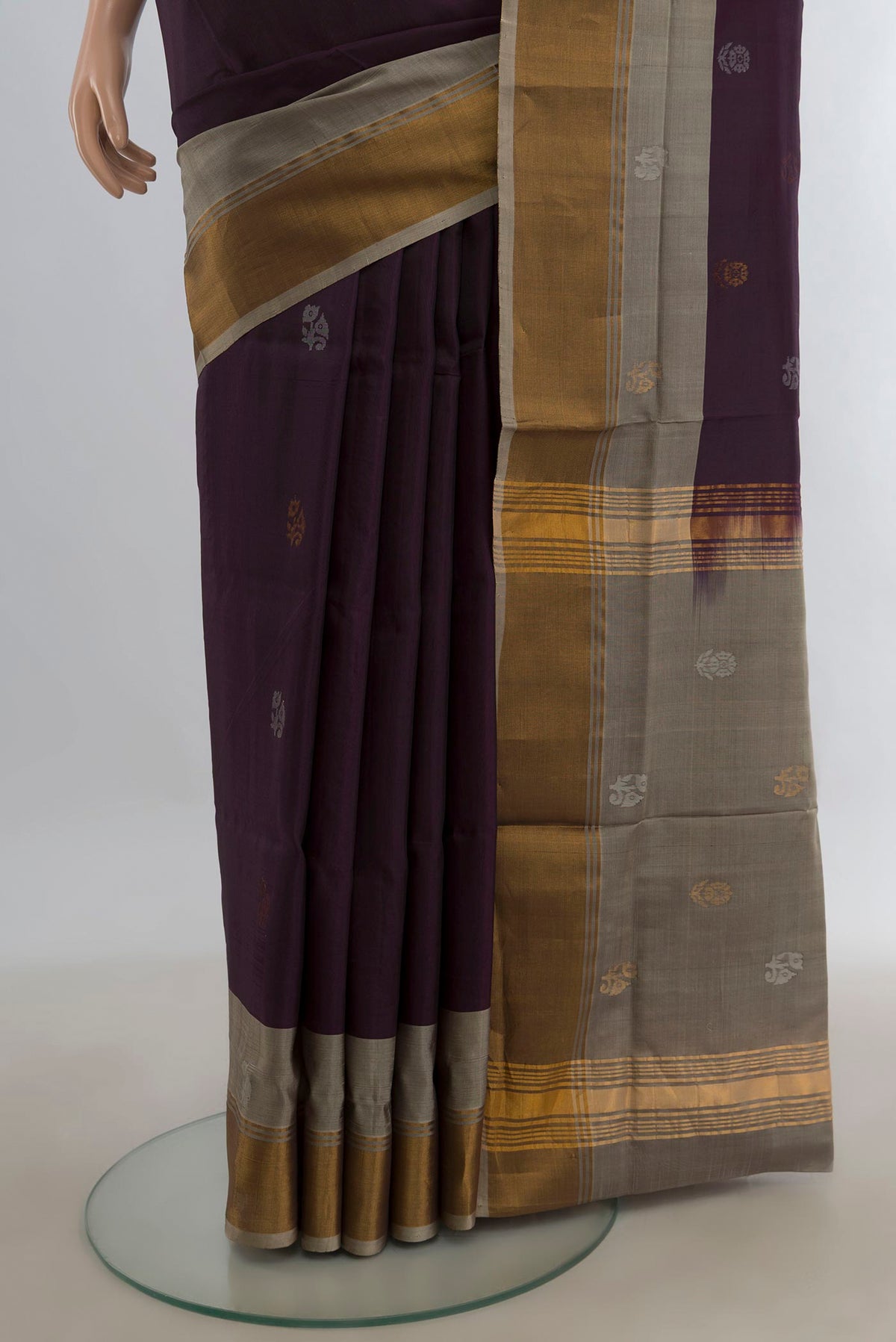 Pleats and pallu of Pure Silk Coffee Brown Uppada Saree with Zari Butta on the body and Zari Border. 