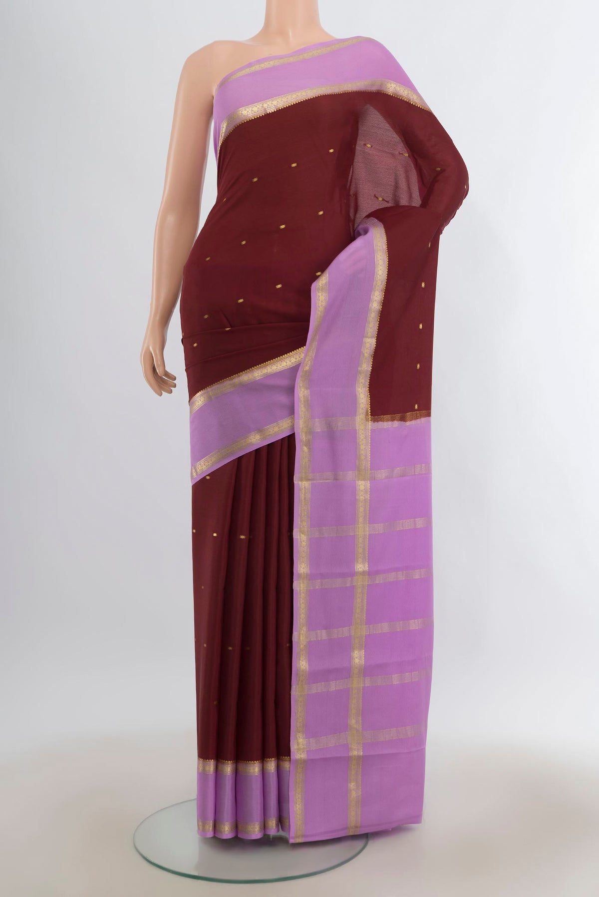 Maroon Mysore Crepe Saree with Zari Butta on the body and Zari Border.  displayed on a mannequin