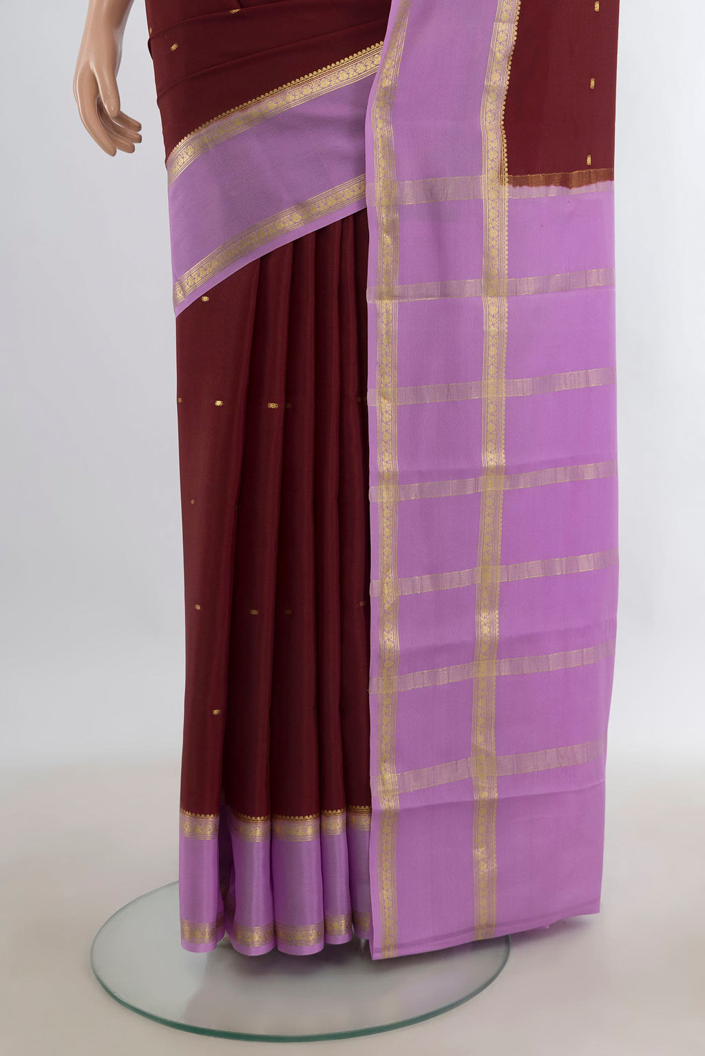 Pleats and pallu of Maroon Mysore Crepe Saree with Zari Butta on the body and Zari Border. 