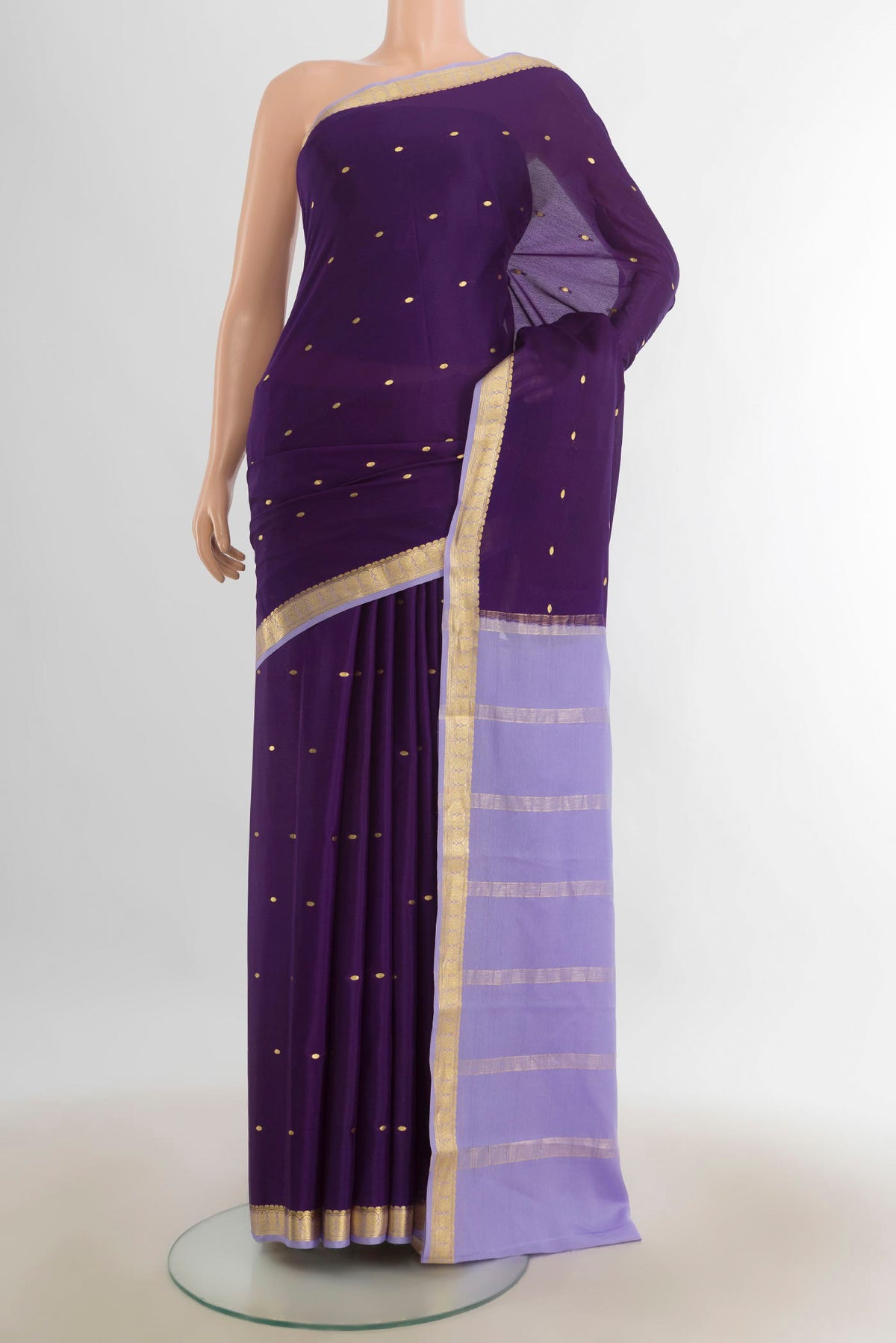 Violet Mysore Crepe Saree with Zari Butta on the body and Silk Border.  displayed on a mannequin