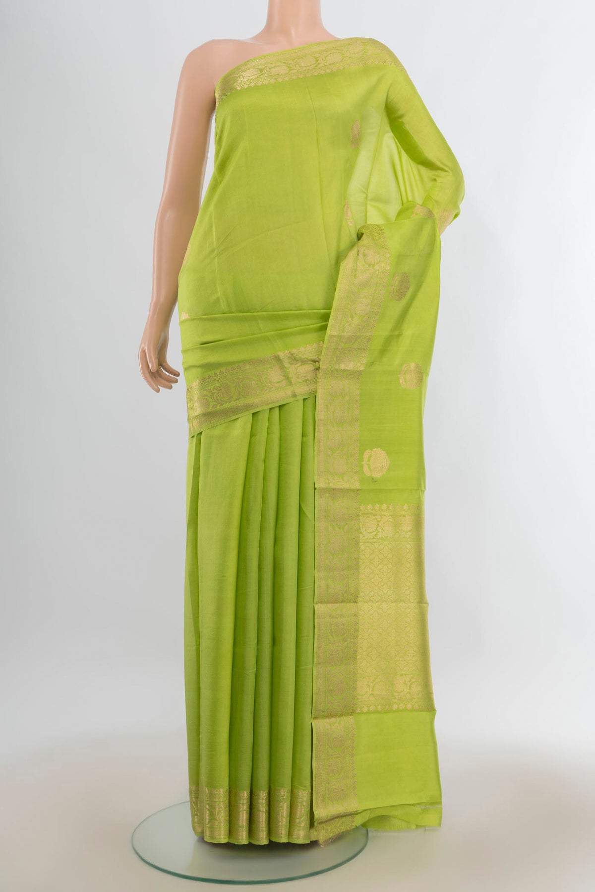 Pure Silk Light Green Banarasi Katan Saree with Zari Butta on the body and Zari Border.  displayed on a mannequin