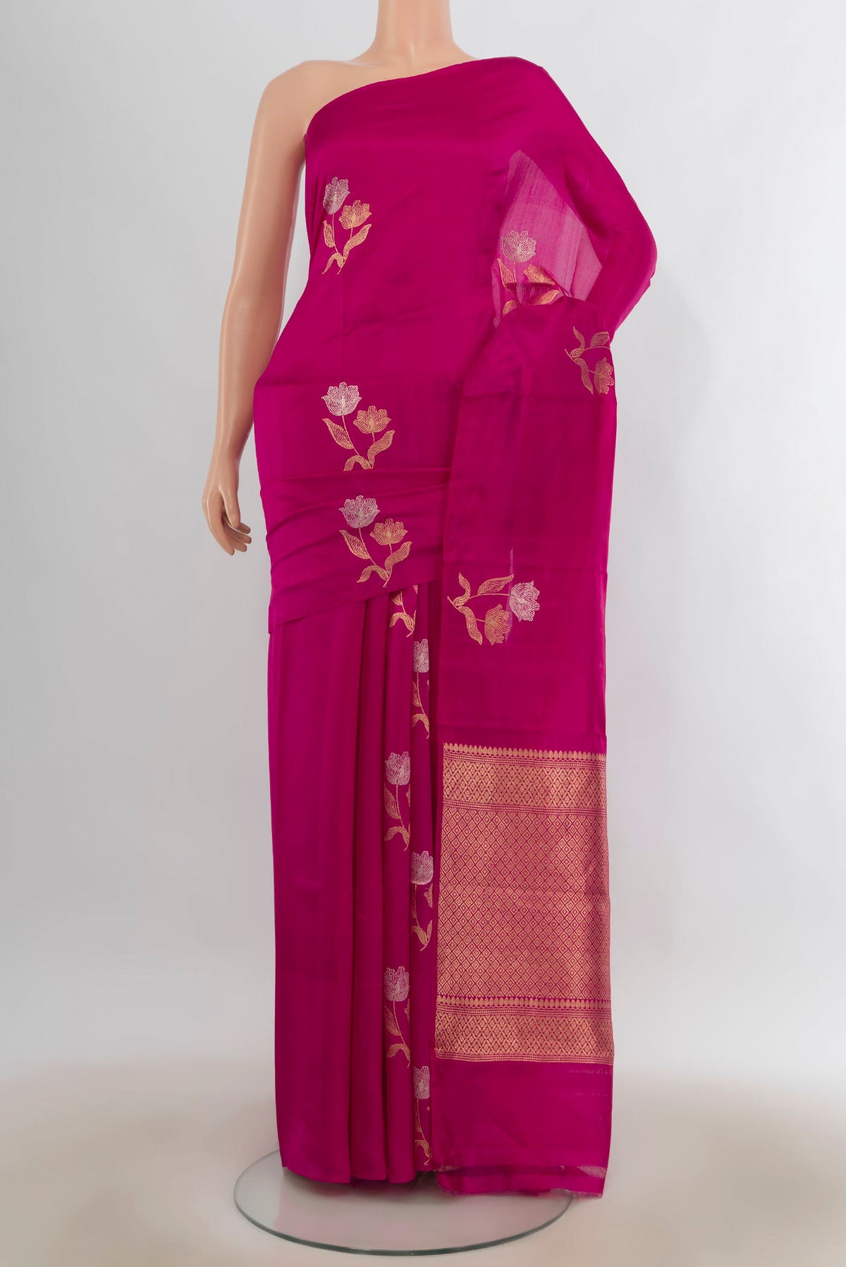 Pure Silk Pink Banarasi Katan Saree with Zari Butta on the body and Without Border.  displayed on a mannequin