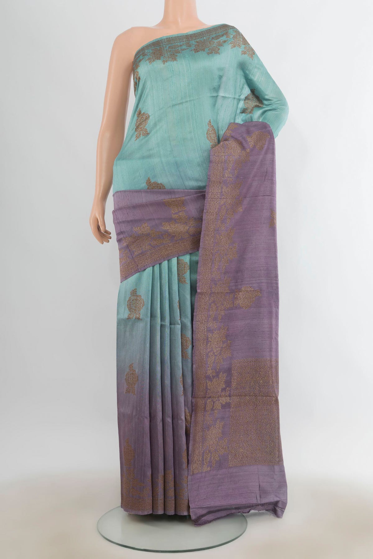 Multi Color Tussar Saree with Zari Butta on the body and Zari Border.  displayed on a mannequin