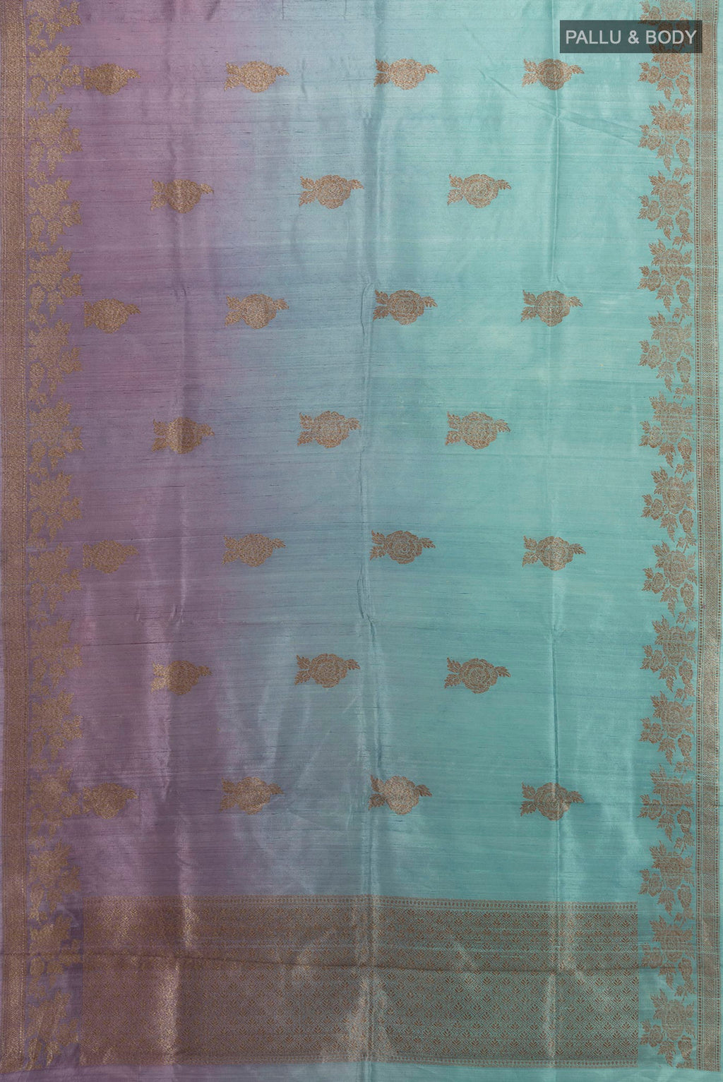 Flat view of Multi Color Tussar Saree with Zari Butta on the body and Zari Border. 