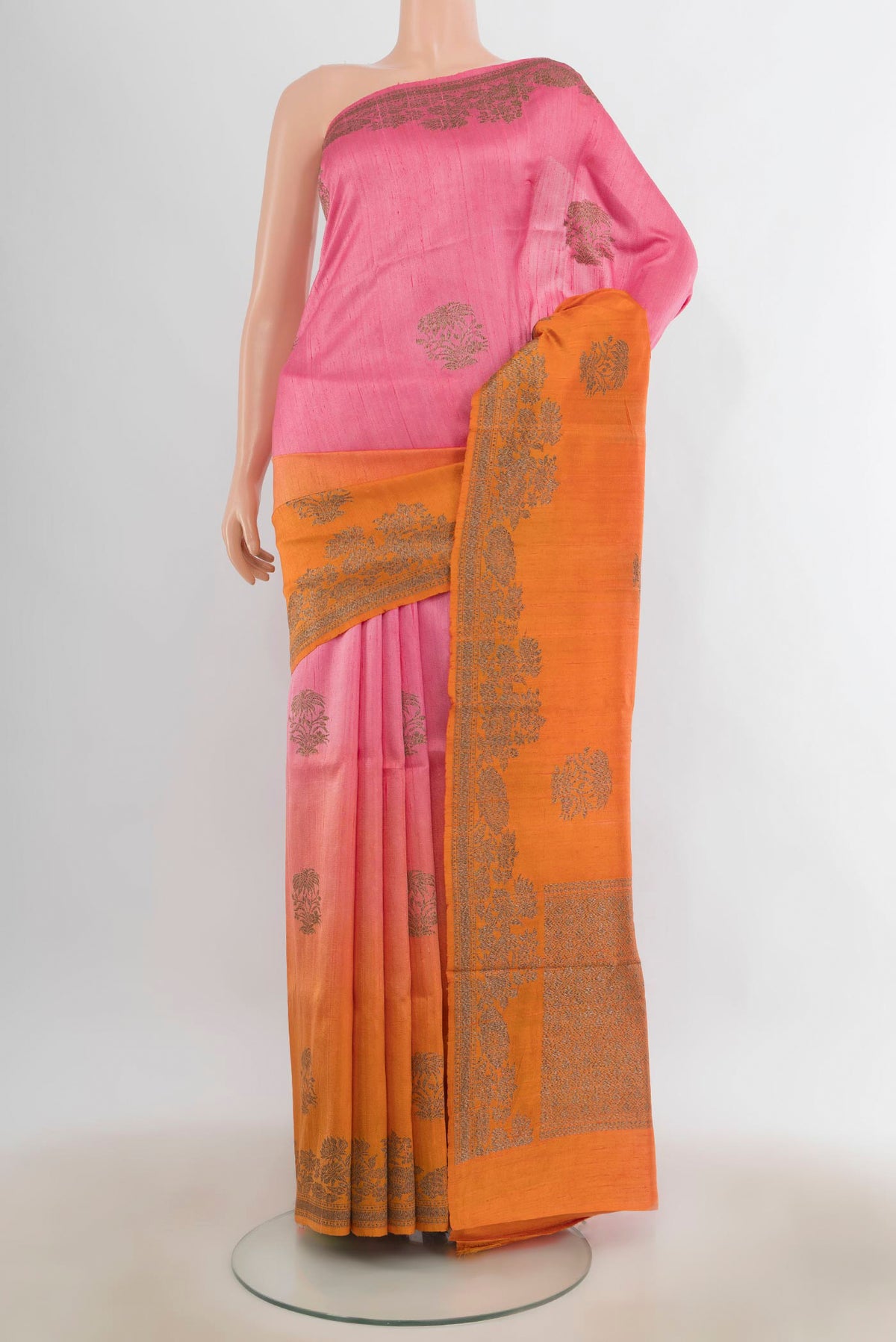 Multi Color Tussar Saree with Zari Butta on the body and Zari Border.  displayed on a mannequin