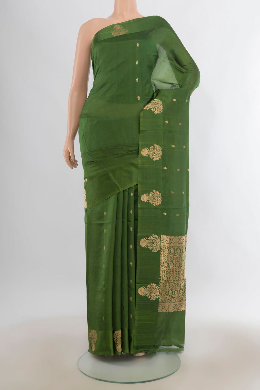 Pure Silk Green Banarasi Katan Saree with Zari Butta on the body and Satin Border.  displayed on a mannequin