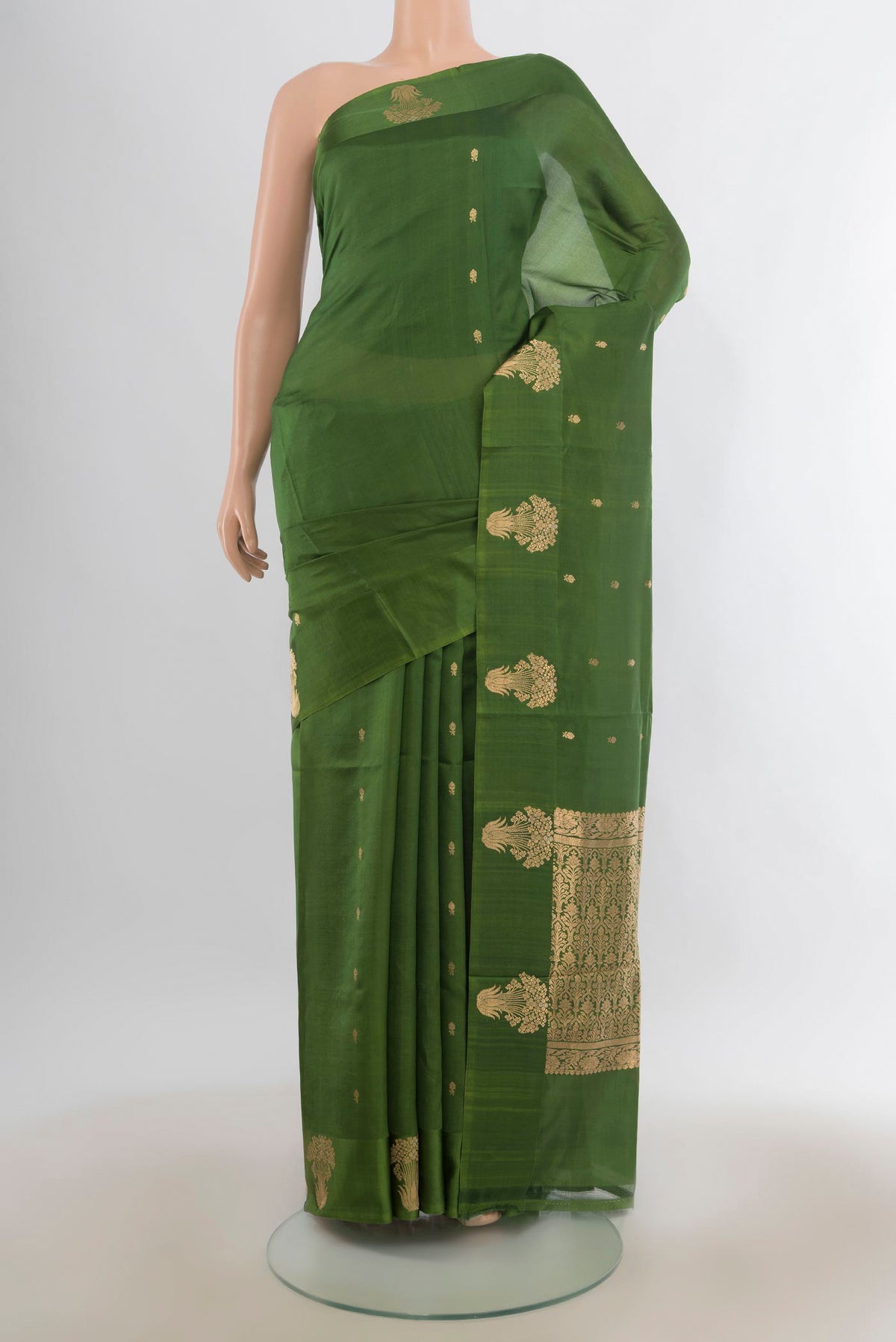Pure Silk Green Banarasi Katan Saree with Zari Butta on the body and Satin Border.  displayed on a mannequin