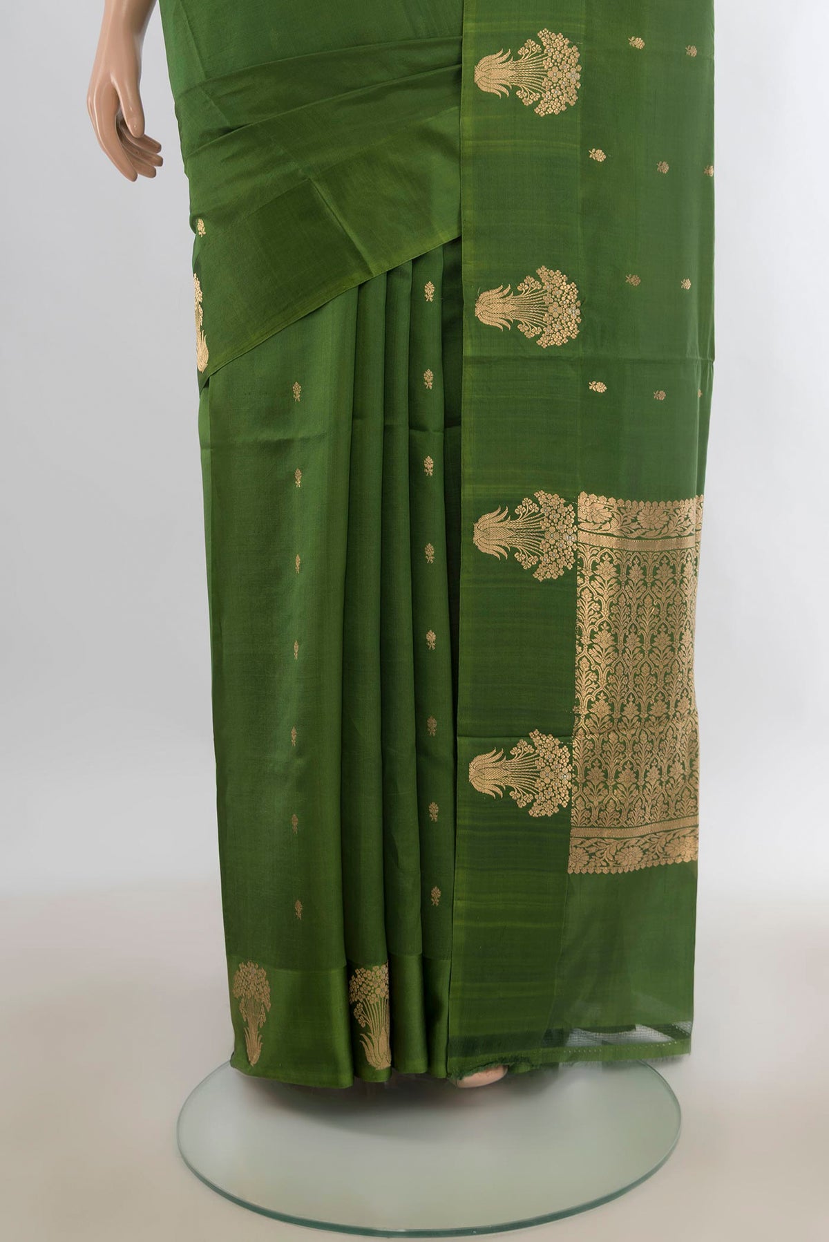 Pleats and pallu of Pure Silk Green Banarasi Katan Saree with Zari Butta on the body and Satin Border. 