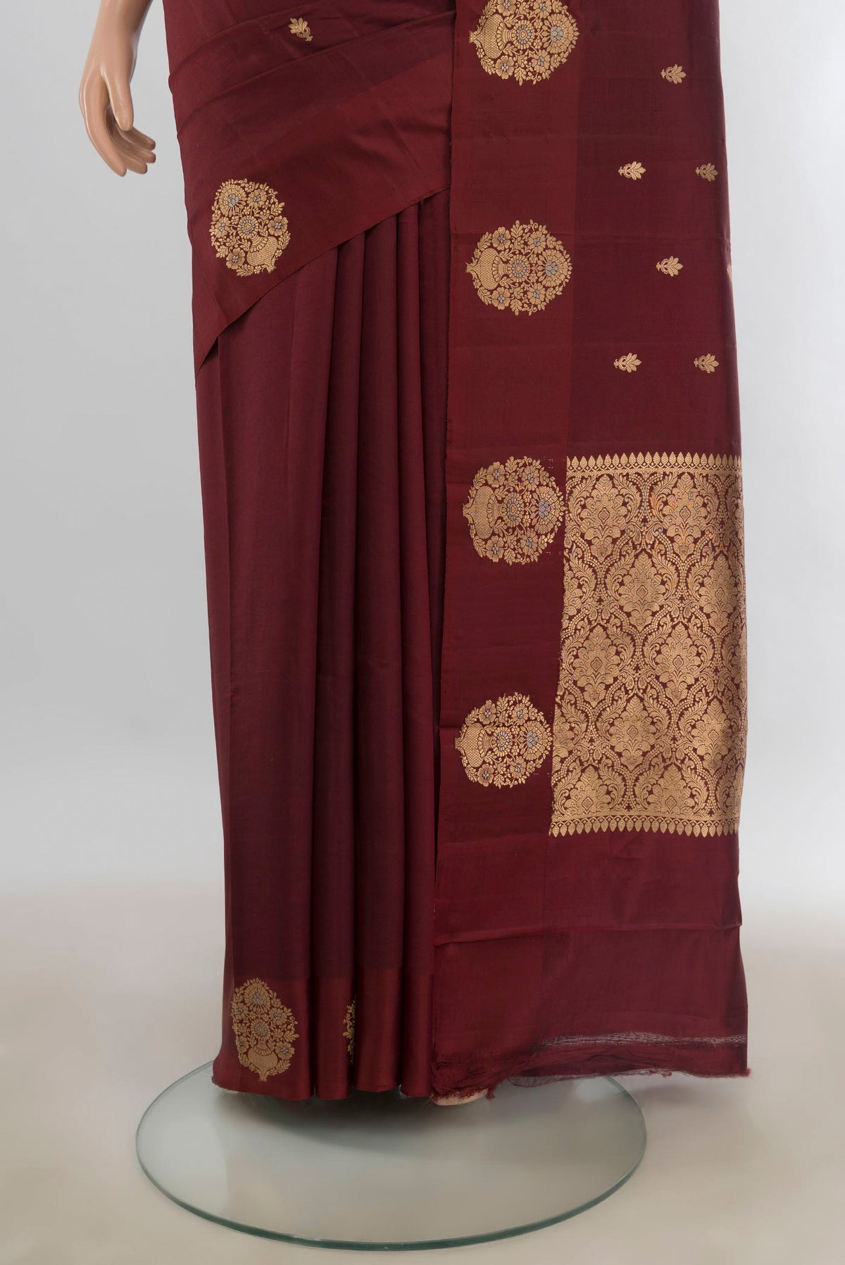 Pleats and pallu of Pure Silk Coffee Brown Banarasi Katan Saree with Zari Butta on the body and Plain Border. 