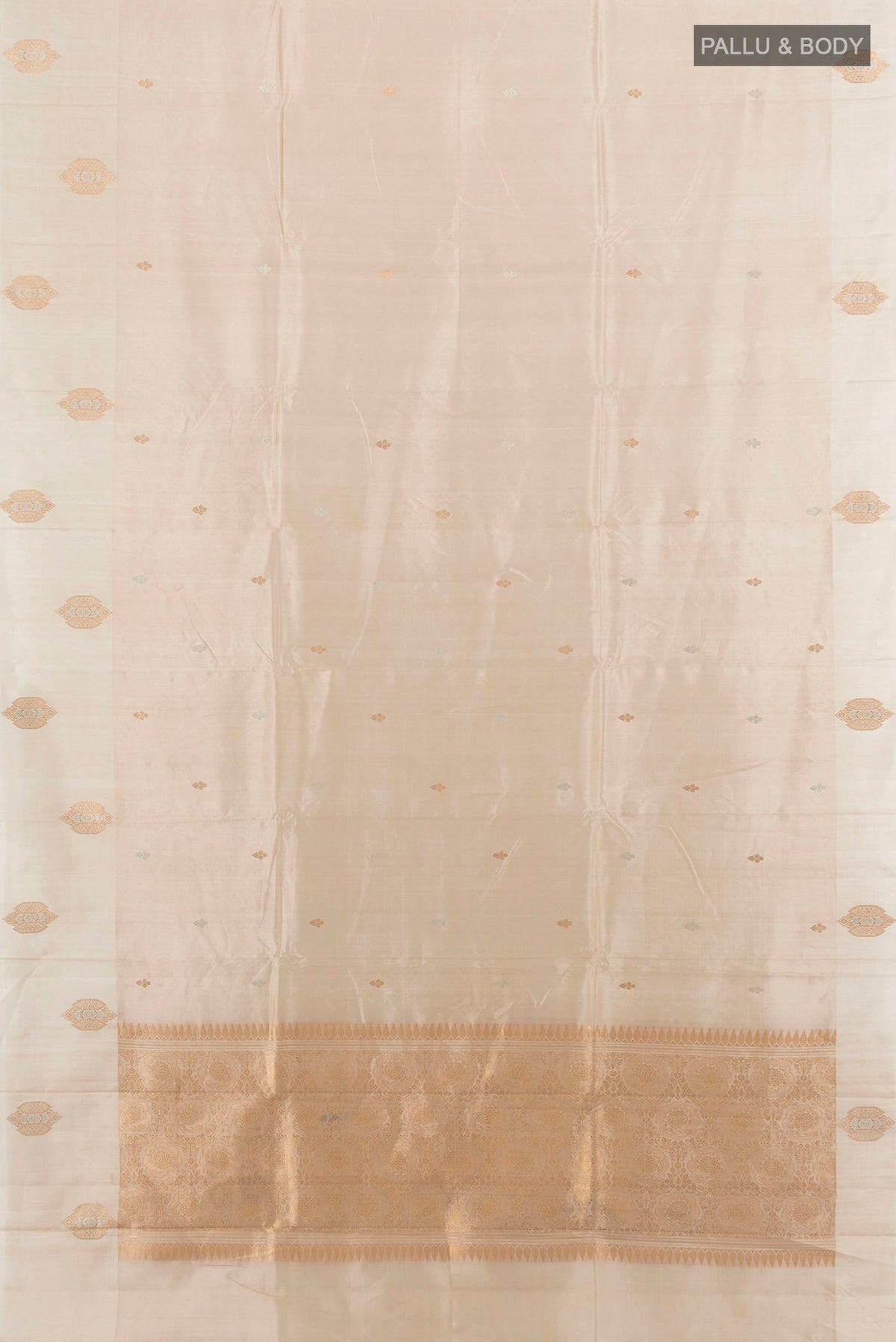 Flat view of Pure Silk Cream Banarasi Katan Saree with Zari Butta on the body and Plain Border. 