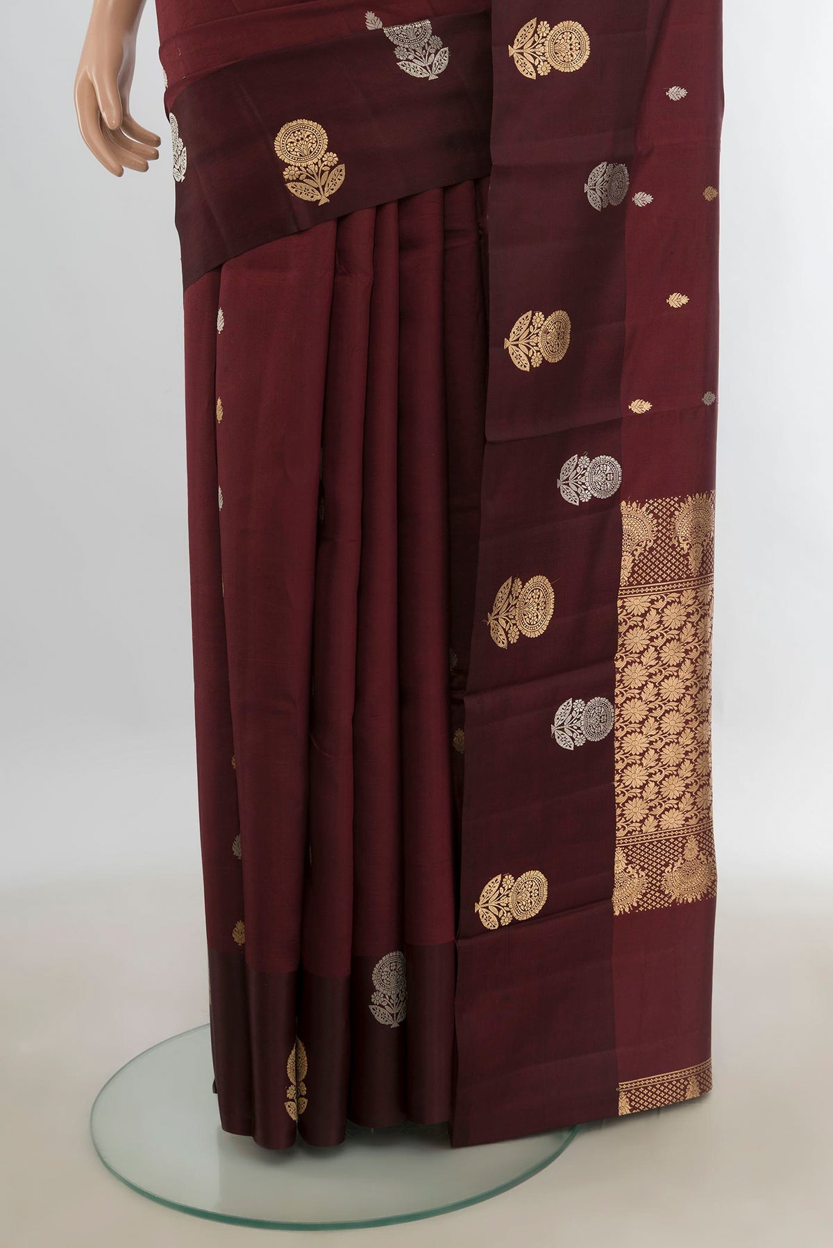 Pleats and pallu of Pure Silk Coffee Brown Banarasi Katan Saree with Zari Butta on the body and Silk Border. 