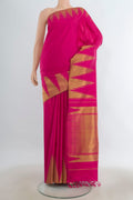 Pure Silk Pure Zari Dark Pink Kanjivaram Saree with Zari Butta on the body and Silk Border.  displayed on a mannequin