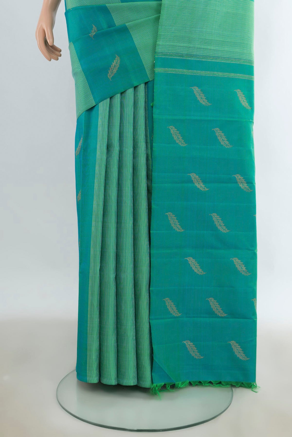 Pleats and pallu of Pure Silk Turquoise Kanchipuram Saree with Stripes on the body and Without Border. 