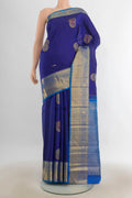 Pure Silk Dark Blue Kanjivaram Saree with Zari Butta on the body and Silk Border.  displayed on a mannequin