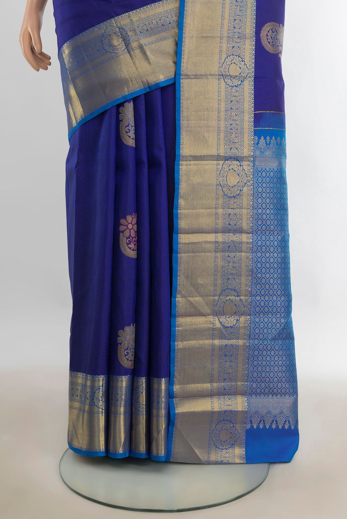 Pleats and pallu of Pure Silk Dark Blue Kanjivaram Saree with Zari Butta on the body and Silk Border. 