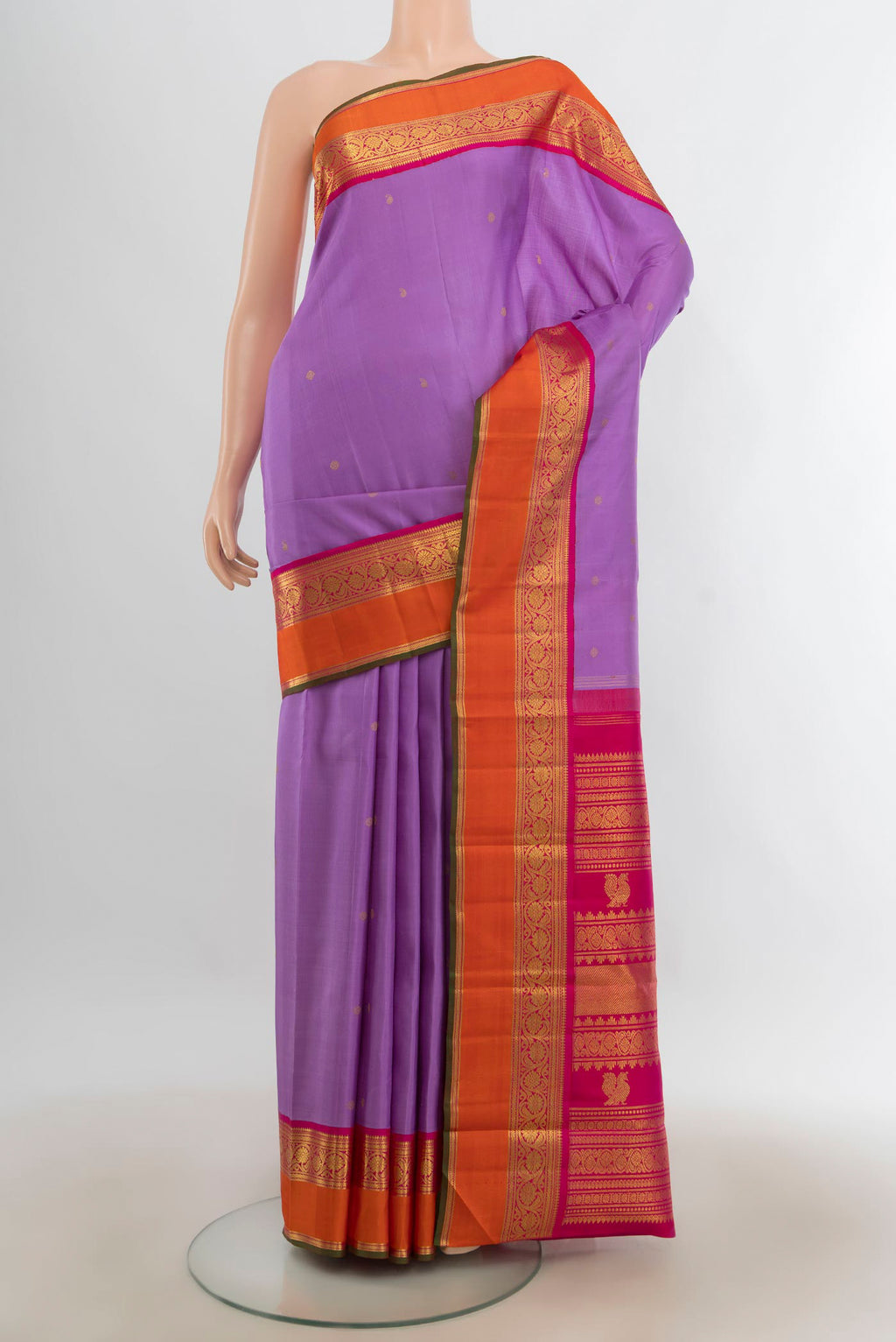 Pure Silk Pure Zari Lavender Kanjivaram Saree with Zari Butta on the body and Silk Border.  displayed on a mannequin